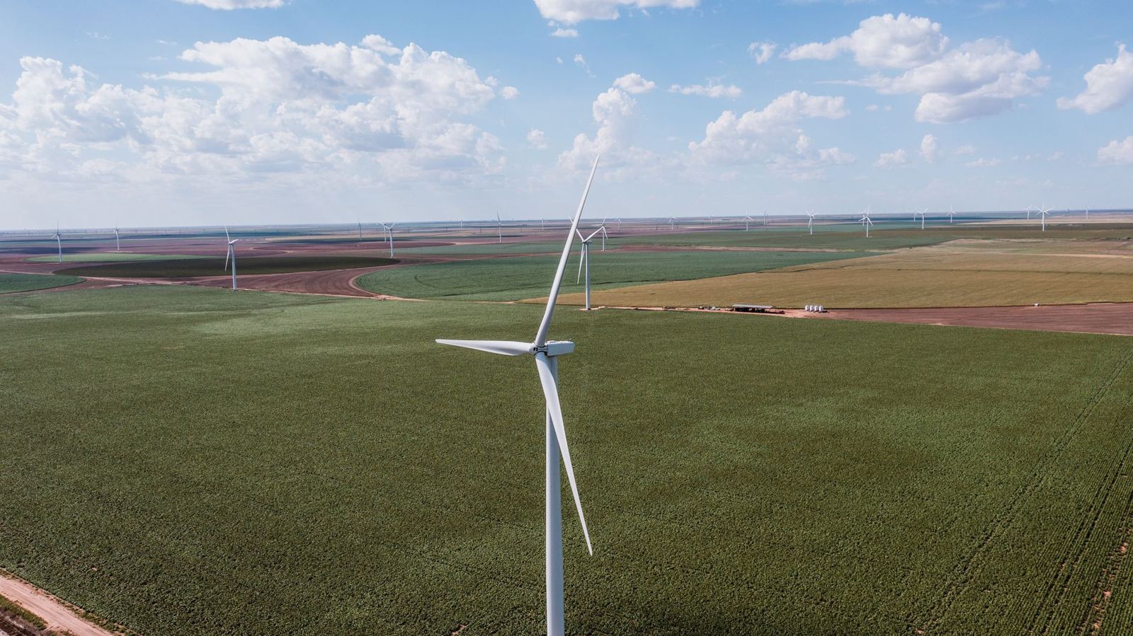 Aerial view of West Texas farmland with wind turbines